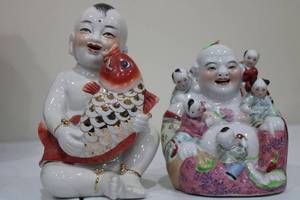 lot 45 image: Set of 2 Porcelain Figurines Child with Fish and Happy Buddha