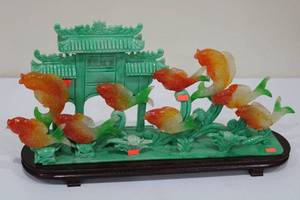 lot A-46 image: Colorful Carving of Fish and Pagoda Scene on Wooden Base