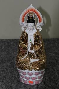lot 66 image: Porcelain Figurine of Buddhist Deity with Gold Accents