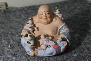 lot 69 image: Vintage Porcelain Laughing Buddha Figurine with Children