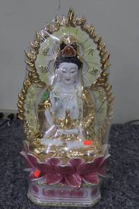 lot 82 image: Gold and White Porcelain Buddha Statue with Floral Base