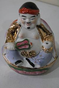 lot 86 image: Vintage Japanese Porcelain Lucky Figurine with Floral Detailing
