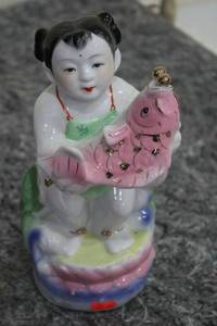 lot 89 image: Porcelain Figurine of Child with Pink Fish