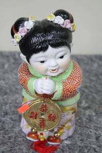 lot 93 image: Ornate Hand-Painted Ceramic Figurine of Child with Calligraphy Plaque