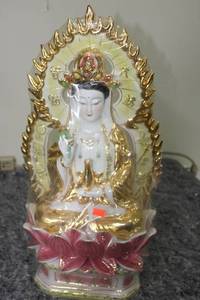 lot 122 image: Porcelain Guan Yin Statue with Lotus Motif