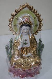 lot 139 image: Elegant Porcelain Goddess Figurine with Gold and Green Leaf Details