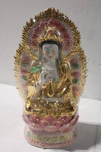 lot 424 image: Elegant Gold and Porcelain Guanyin Statue with Lotus Base