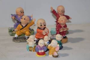 lot 441 image: Collection of 10 Colorful Monk Figurines in Various Poses