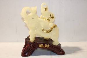 lot 490 image: Ornate Ivory-Style Elephant Figurine with Gold Accents on Wooden Base