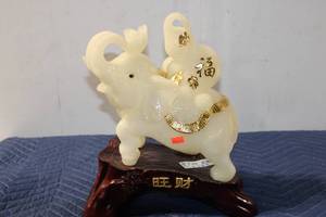 lot 503 image: Vintage Carved White Elephant Figurine with Gold Accents on Wooden Base