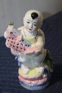 lot 524 image: Vintage Porcelain Figurine of a Boy Holding a Fish