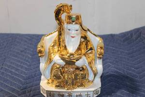 lot 526 image: Elegant Gold-Accented Porcelain Figurine of a Traditional Chinese God