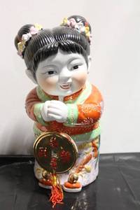 lot 560 image: Ceramic Lucky Child Figurine with Gold Coin and Traditional Attire - 13 Tall