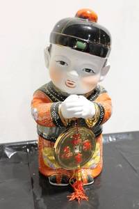lot 564 image: Chinese Porcelain Figure of a Child Holding a Lucky Coin - 12 Inches Tall