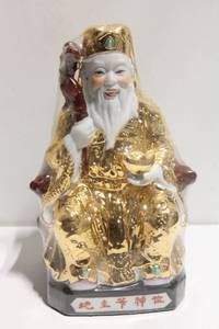 lot 611 image: Gilded Ceramic Figure of a Traditional Chinese Deity with Gold Accents