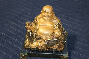 lot 690 image: Gold-Plated Laughing Buddha Figurine on Glass Base