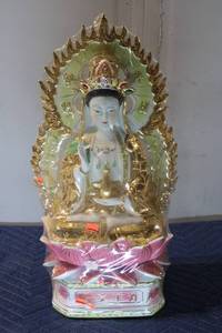 lot 716 image: Porcelain Guanyin Statue with Golden Accents