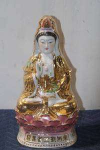 lot 766 image: Gold and Porcelain Seated Buddha Figurine