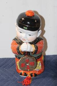 lot 863 image: Oriental Porcelain Figurine with Traditional Attire and Bas-Relief Details