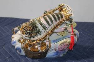 lot 871 image: Porcelain and Gold Lobster Figurine on Wave Base