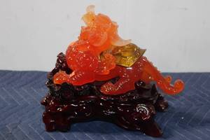 lot 873 image: Chinese Red Agate Resin Pi Xiu Wealth Figurine