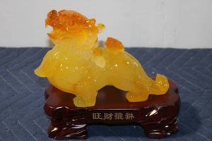 lot 1107 image: Vintage Chinese Yellow Resin Foo Dog Sculpture on Wooden Base