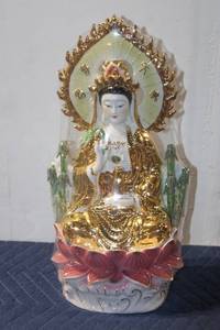 lot 1204 image: Porcelain Bodhisattva statuette with Gold Accents and Lotus Base
