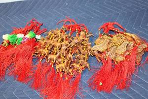 lot 1242 image: Collection of Decorative Chinese Tassels with Beads, Animals, and Vegetables