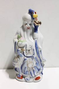 lot 675 image: Porcelain Figurine of Elder with Crane and Staff