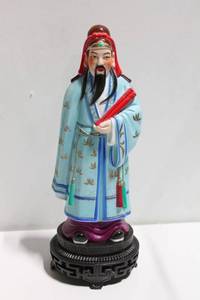 lot 747 image: Hand-Painted Asian Ceremonial Figurine on Ornate Base