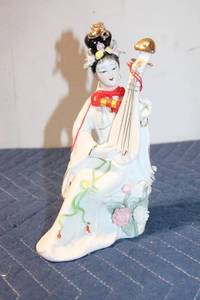 lot 1033 image: Porcelain Figurine of Woman with Musical Instrument