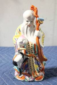lot 1042 image: Colorful Porcelain Figurine of Elder with Staff and Crane