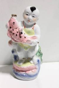 lot 1117 image: Vintage Porcelain Figurine of Boy Holding Pink Fish