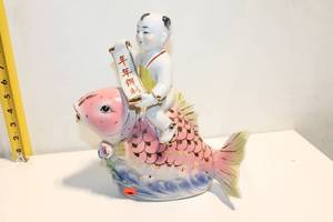 lot 1120 image: Vintage Porcelain Figurine of Child on Carp Fish