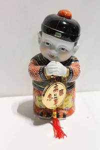 lot 1127 image: Asian Porcelain Figurine with Disc and Tassels, 12 inches