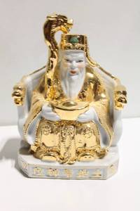 lot 1139 image: Gold Accented Porcelain God Statue with Feng Shui Symbolism