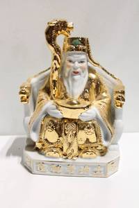 lot 1191 image: Oriental Porcelain Deity Figurine with Gold Accents