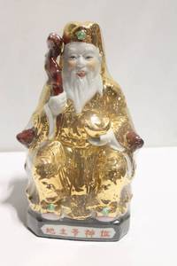 lot 1193 image: Porcelain Figurine of a Deity with Golden Cloak