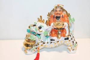 lot 1199 image: Hand-Painted Porcelain Wealth God Figurine on Dragon