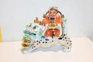 lot 1201 image: Chinese Gold Gilded Porcelain Deity Figurine on Lion