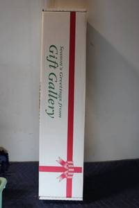 lot 1298 image: Gift Wrapping Set with Rolls, Bows, and Ribbon Spools