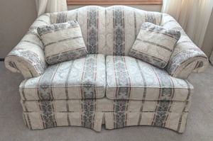 lot 202 image: Cream with Green and Red Print Upholstered Loveseat by Cochrane Furniture