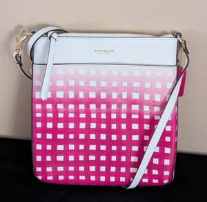 lot 217 image: Coach Saffiano Pink and White Crossbody Bag