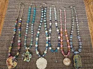 lot 13 image: Assorted Hand-Crafted Necklaces, Unique Charms, Beads