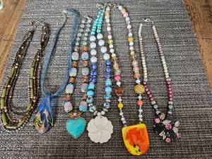 lot 17 image: Assorted Hand-Crafted Necklaces, Unique Charms, Beads