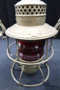 lot 35 image: RED GLASS GLOBE HAND LANTERN