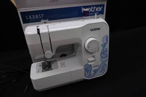 lot 104 image: SEWING MACHINE