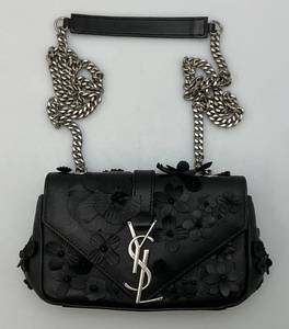 lot 79 image: Yves Saint Laurent Black Leather Floral Applique Baby Monogram Bag 