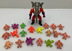 lot 220 image: 1985 MUSCLE Men, 1985 MOTU Snout Squirting Action Figure & More