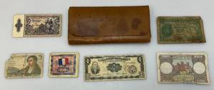 lot 222 image: Vintage Leather Money Holder With Vintage Foreign Currency
